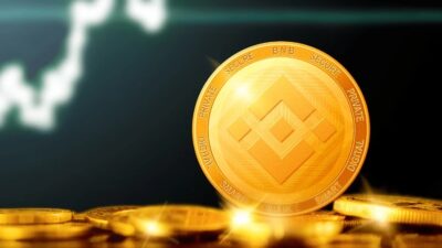 ارز دیجیتال فیزیکی بایننس با پس زمینه نمودار بازار کریپتوکارنسی